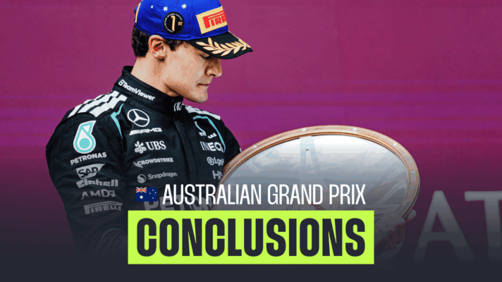 George Russell studies the winners' trophy on the podium in Melbourne with a PlanetF1.com conclusion banner positioned centre-bottom