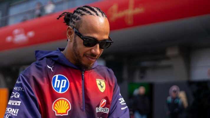 Lewis Hamilton wearing Ferrari's purple Chinese GP team wear.