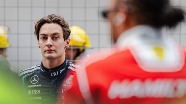 George Russell on the grid in Shanghai with Lewis Hamilton in the foreground