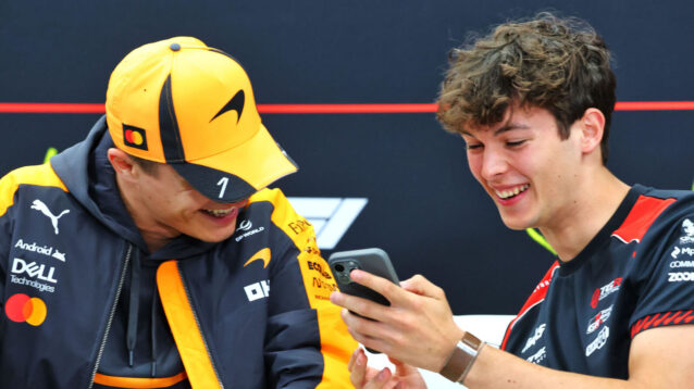 Lando Norris laughing with Oliver Bearman