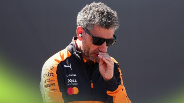 McLaren team principal Andrea Stella with his head down in the paddock.