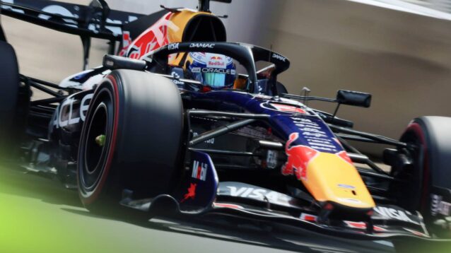 An action shot of Max Verstappen on track with the Red Bull RB22 at Suzuka