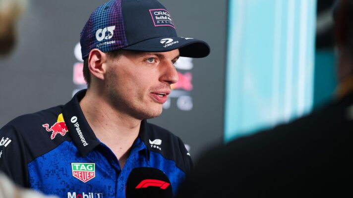 Max Verstappen wearing a Red Bull cap during an interview.