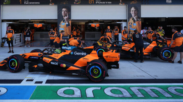 Lando Norris and Oscar Piastri in the pit lane