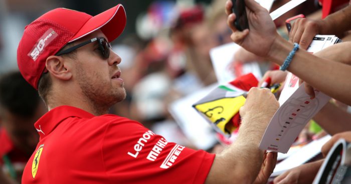 Sebastian-Vettel-signing-autographs-PA