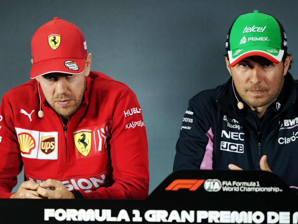 Sebastian Vettel and Sergio Perez serious.jpg
