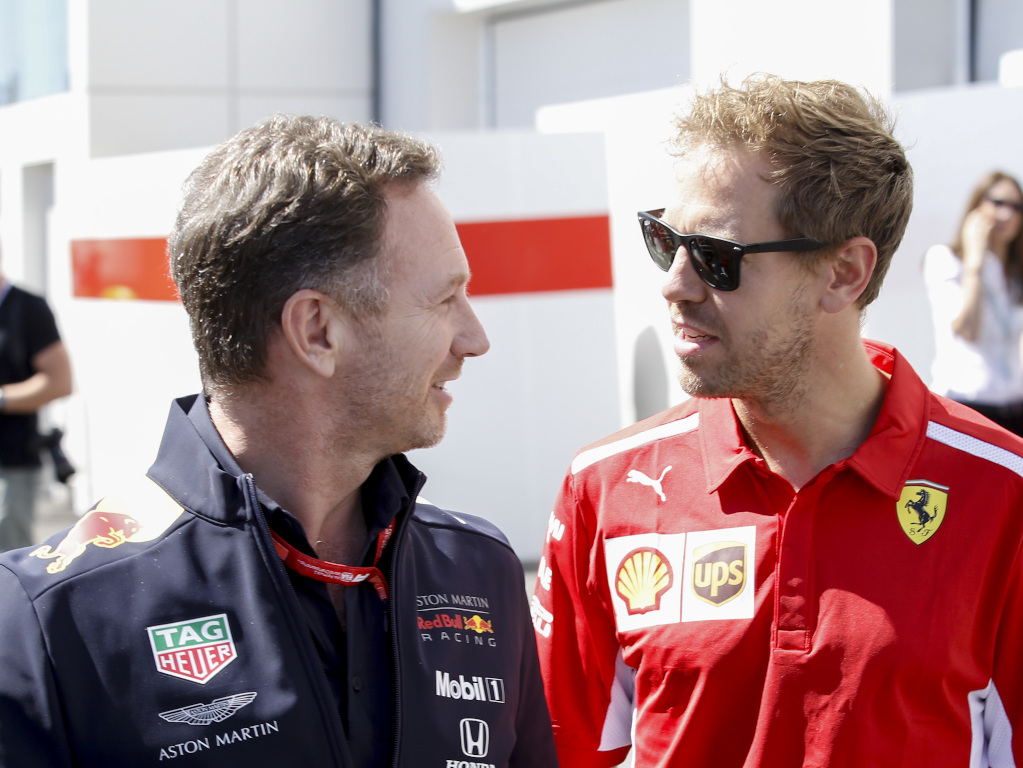 Sebastian Vettel (Ferrari) and Christian Horner (Red Bull)