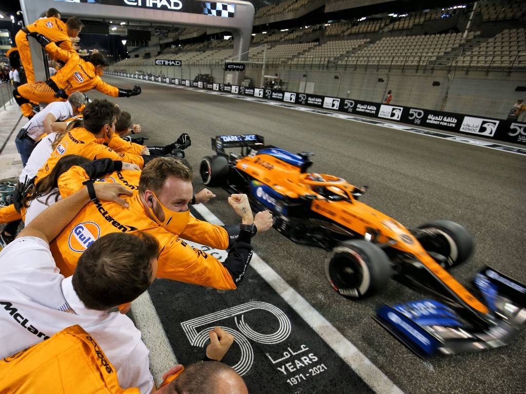 Carlos Sainz crosses the line as McLaren celebrate P3 in the constructors' World Championship