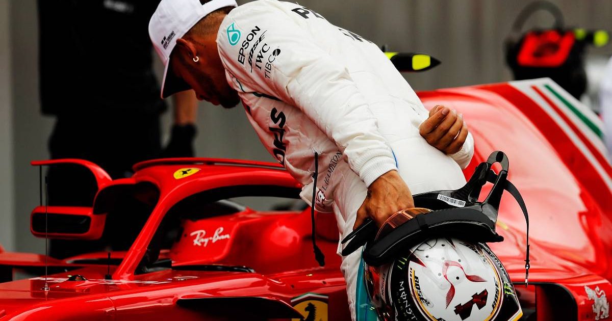 Lewis Hamilton looks at Kimi Raikkonen's Ferrari in 2018