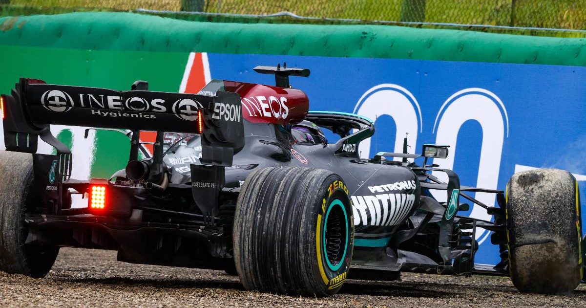 Lewis Hamilton's Mercedes up against the barrier in the Emilia Romagna Grand Prix at Imola before reversing out