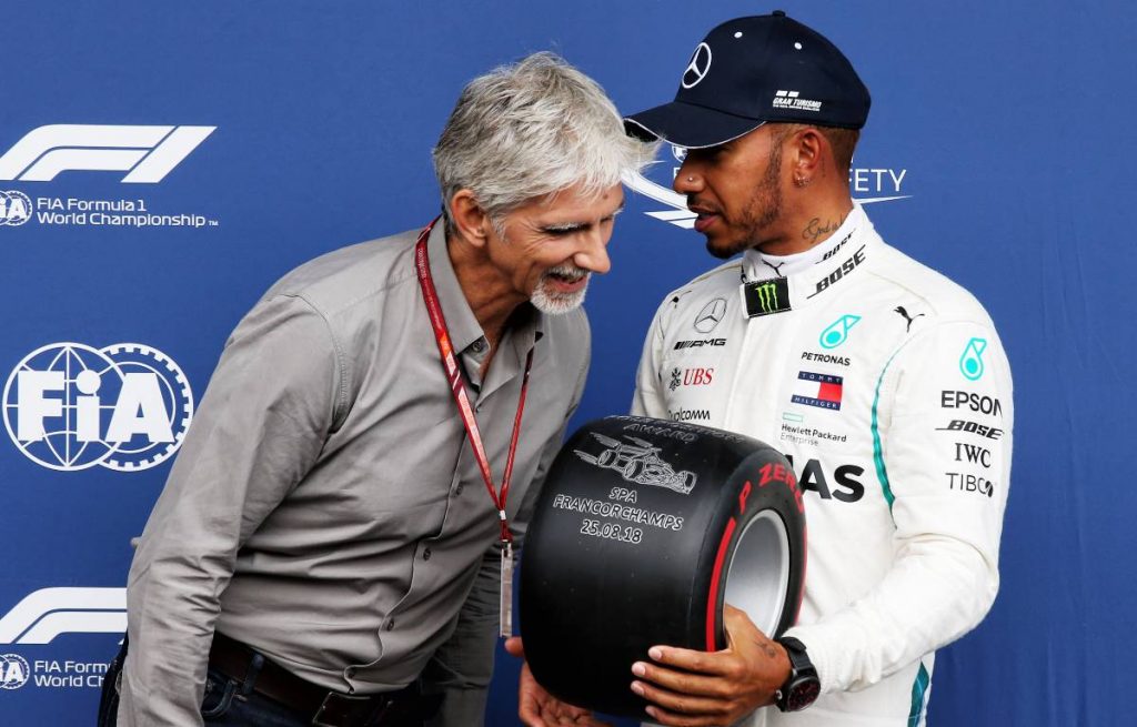 Lewis Hamilton receives the Pole Position Award from Damon Hill at the 2018 Belgian Grand Prix