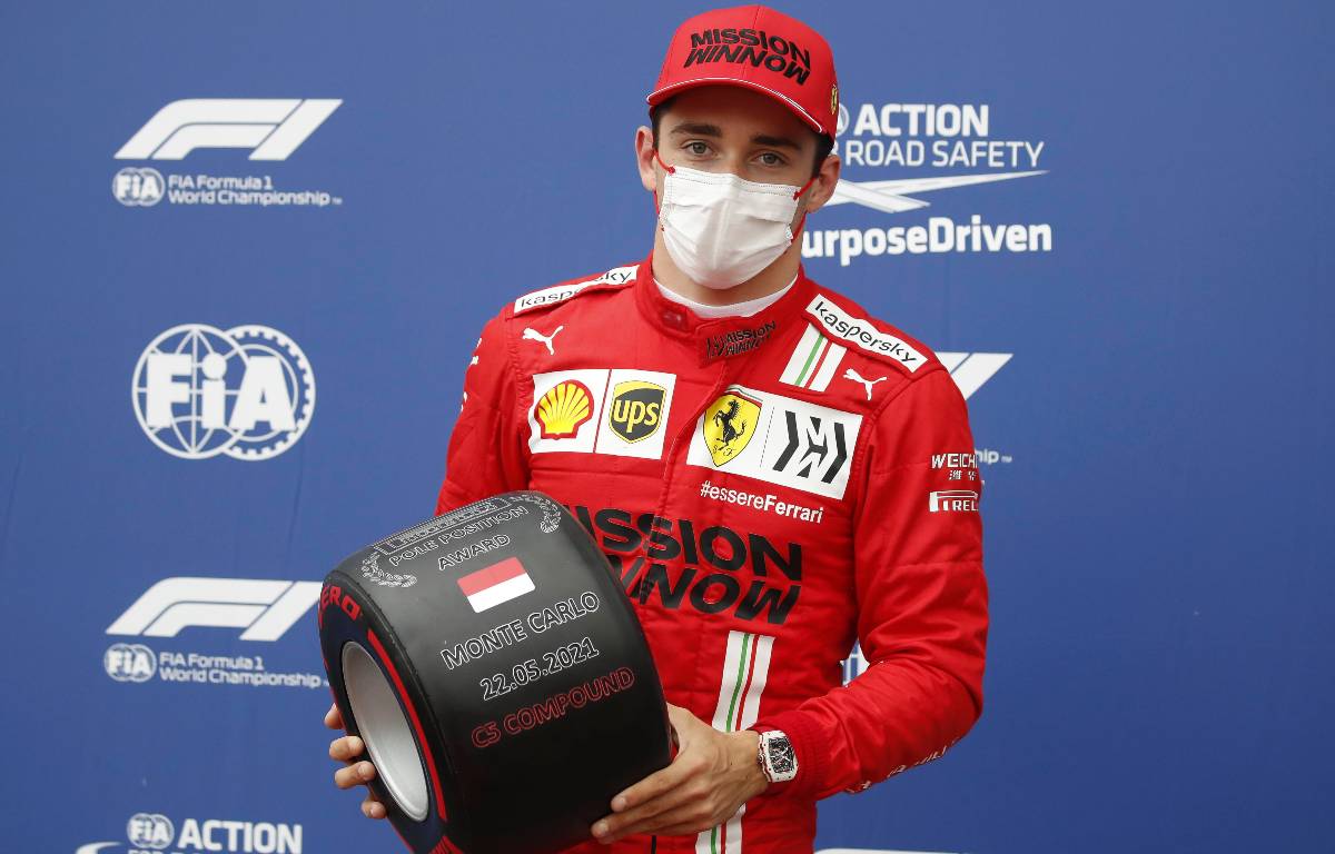 Ferrari's Charles Leclerc with the pole position prize at the 2021 Monaco Grand Prix