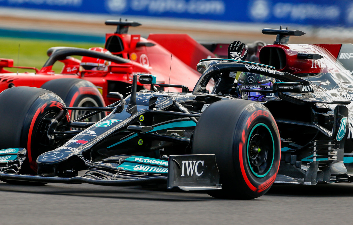 Lewis Hamilton waves Ferrari