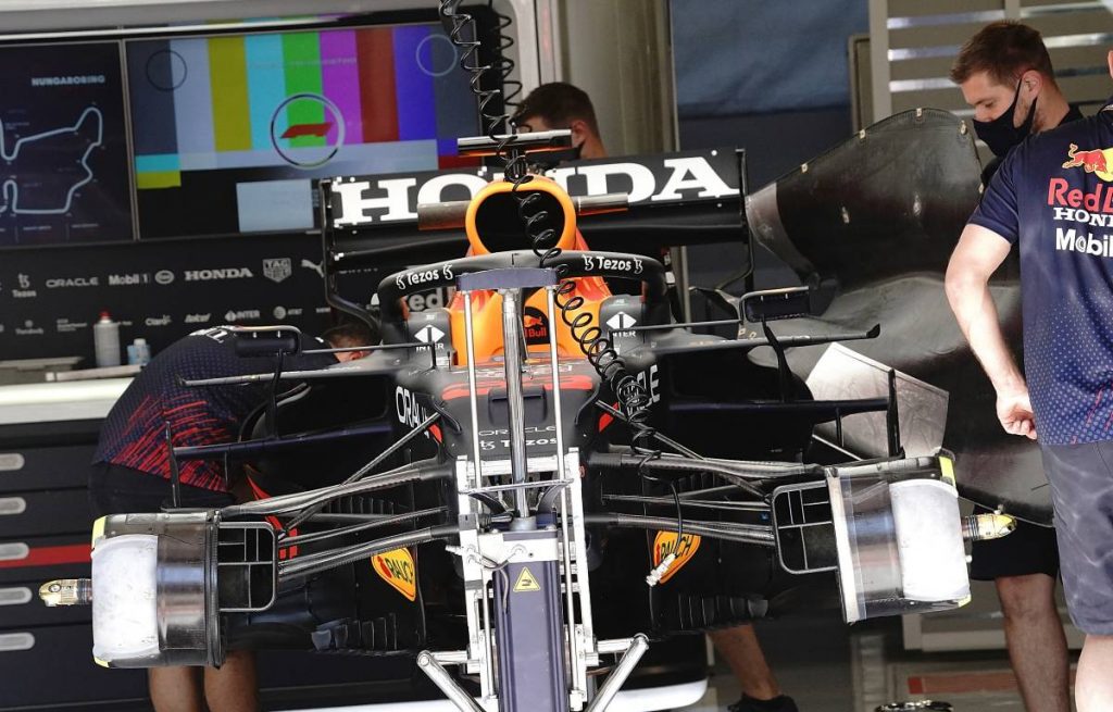 Max Verstappen's car being prepared in the Red Bull garage