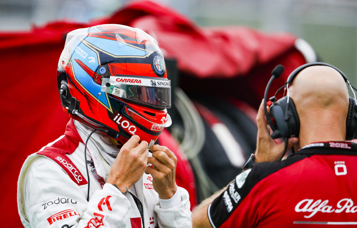 Kimi Raikkonen putting on his helmet. Hungary August 2021.
