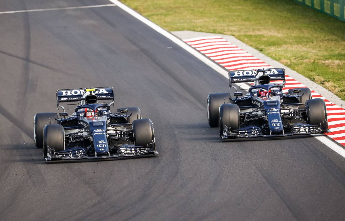 Pierre Gasly passes Yuki Tsunoda in the 2021 Hungarian Grand Prix. Hungaroring 2021.