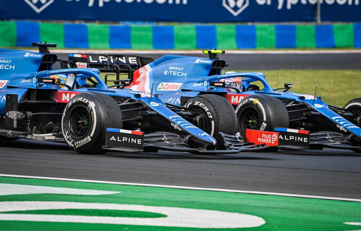 Esteban Ocon and Fernando Alonso of Alpine Renault run alongside each other, Hungarian GP, August 2021.