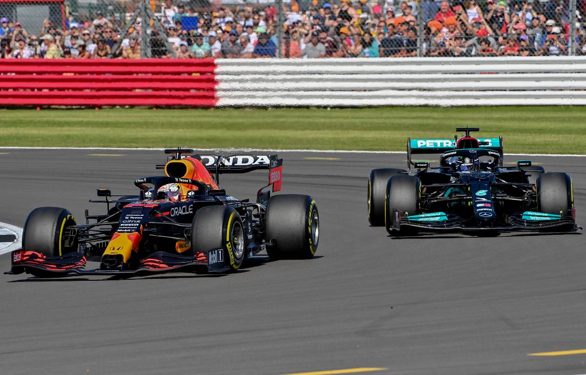 Mercedes' Lewis Hamilton looks to pass Red Bull driver Max Verstappen at Silverstone. July, 2021.