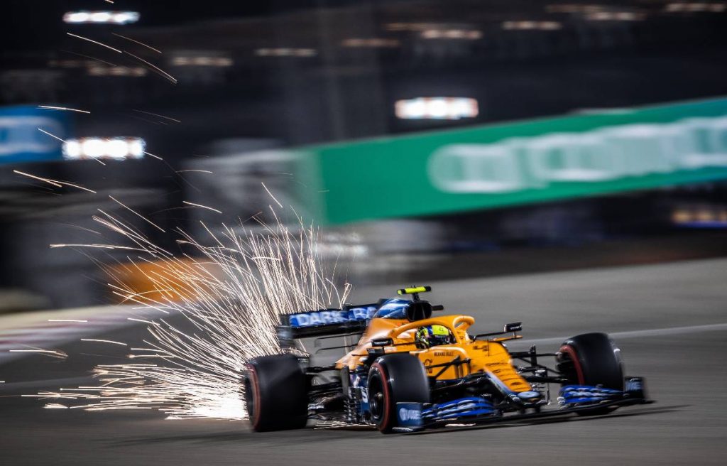 Sparks fly from Lando Norris' McLaren at the Bahrain GP. Sakhir March 2021.