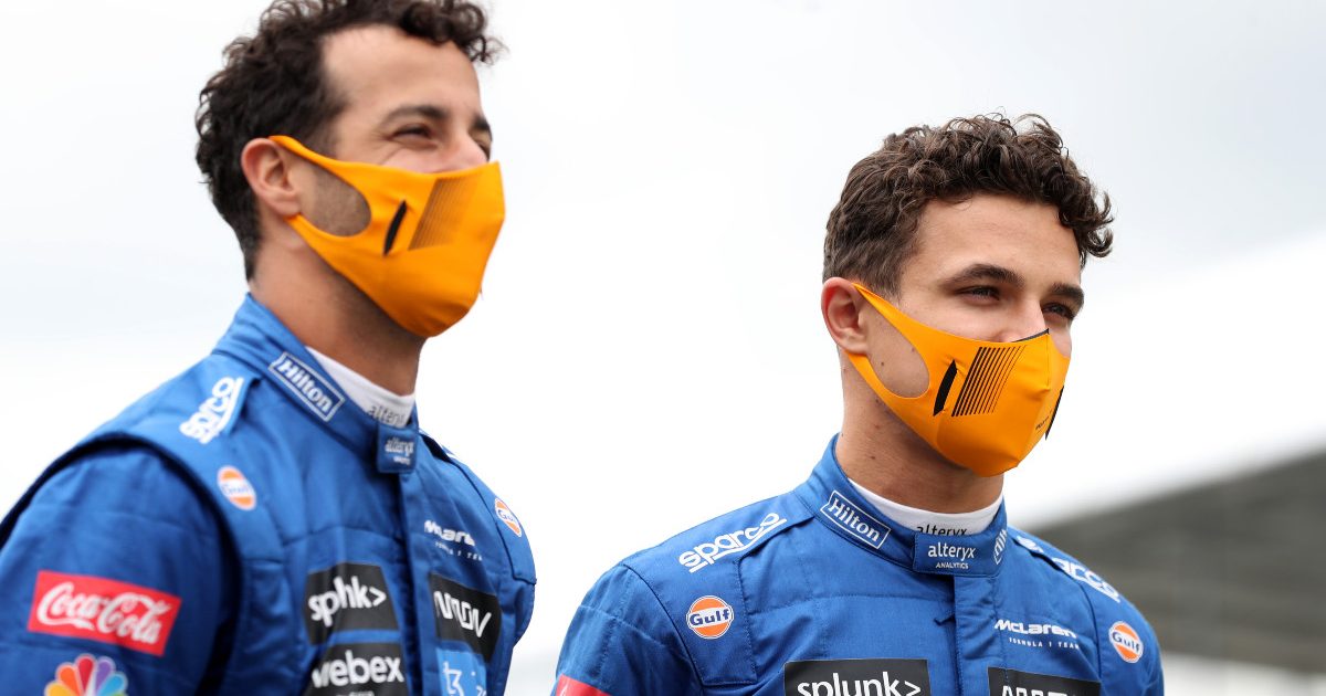 McLaren's Daniel Ricciardo and Lando Norris speaking at the British Grand Prix. July, 2021.