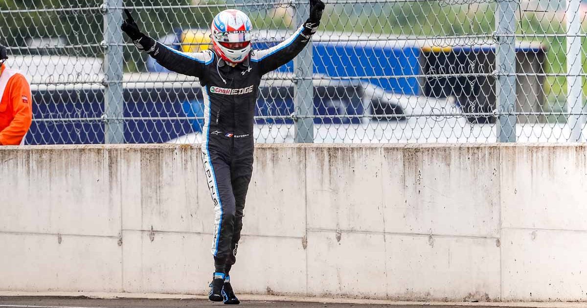 Alpine driver Esteban Ocon celebrates winning the Hungarian GP in 2021.