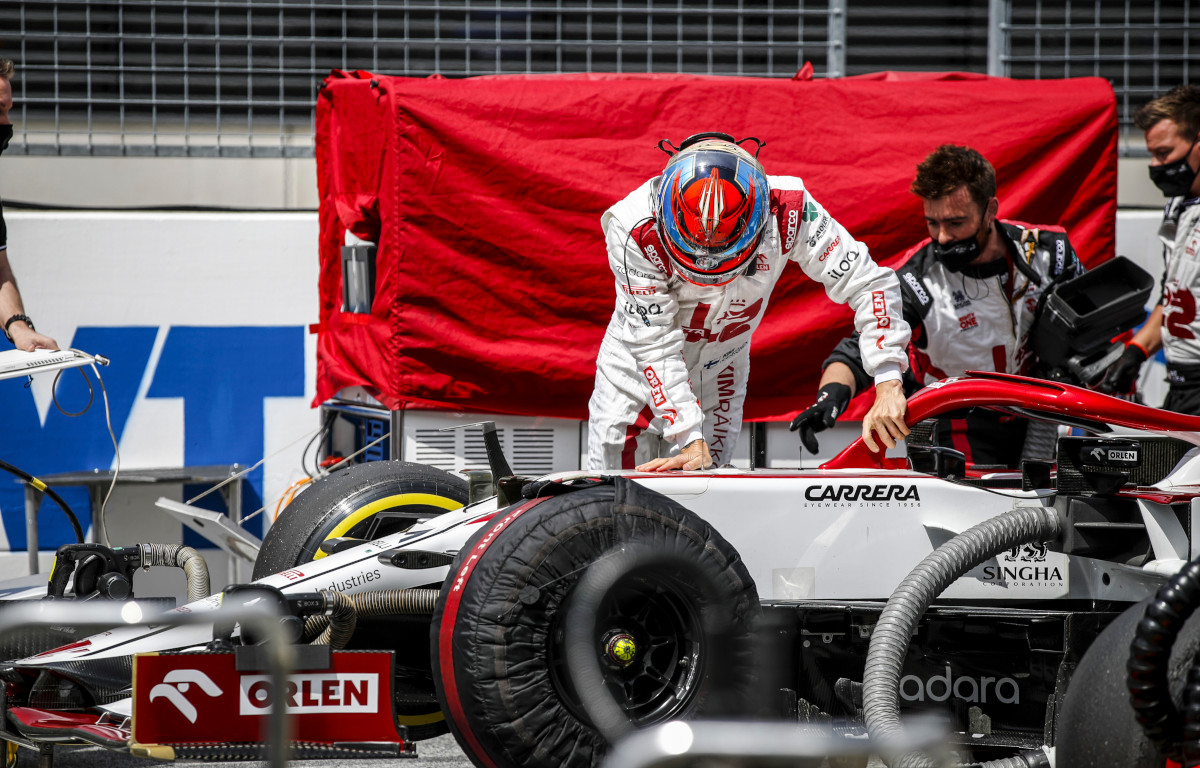 Kimi Raikkonen climbs into his Alfa Romeo. Austria July 2021