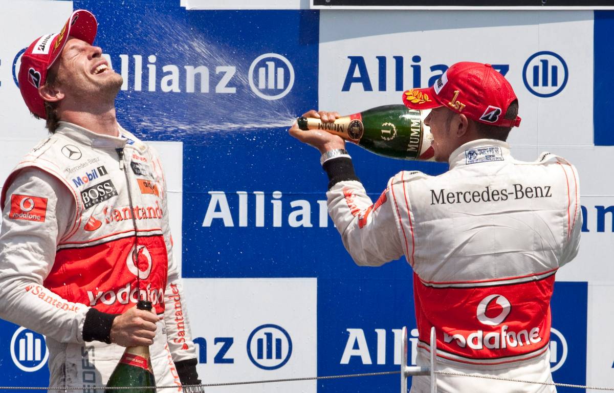 Jenson Button and Lewis Hamilton of McLaren celebrate on the podium. Canada, June 2010.