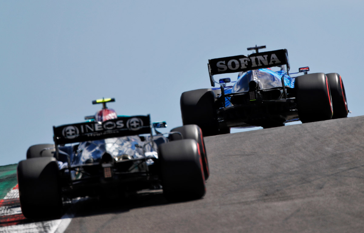 George Russell leads Valtteri Bottas at Portimao. May 2021.