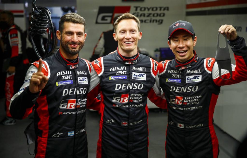 Jose Maria Lopez, Mike Conway and Kamui Kobayashi celebrate pole position for the Le Mans 24-Hour Race. Le Mans August 2021.