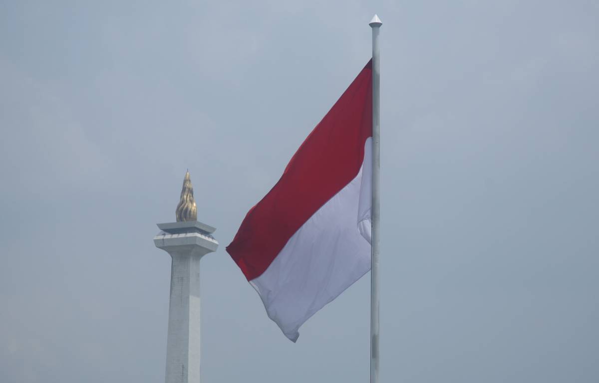 Indonesian flag in Jakarta next to the National Monument