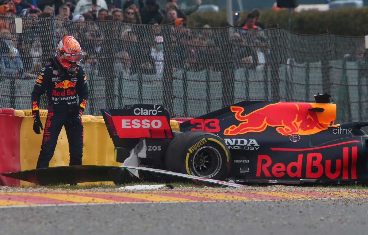 Max Verstappen checks his car after crashing in FP2 in Belgium. August 2021.