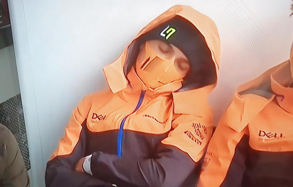 Lando Norris sleeping during the Belgian Grand Prix rain delay. August 2021.