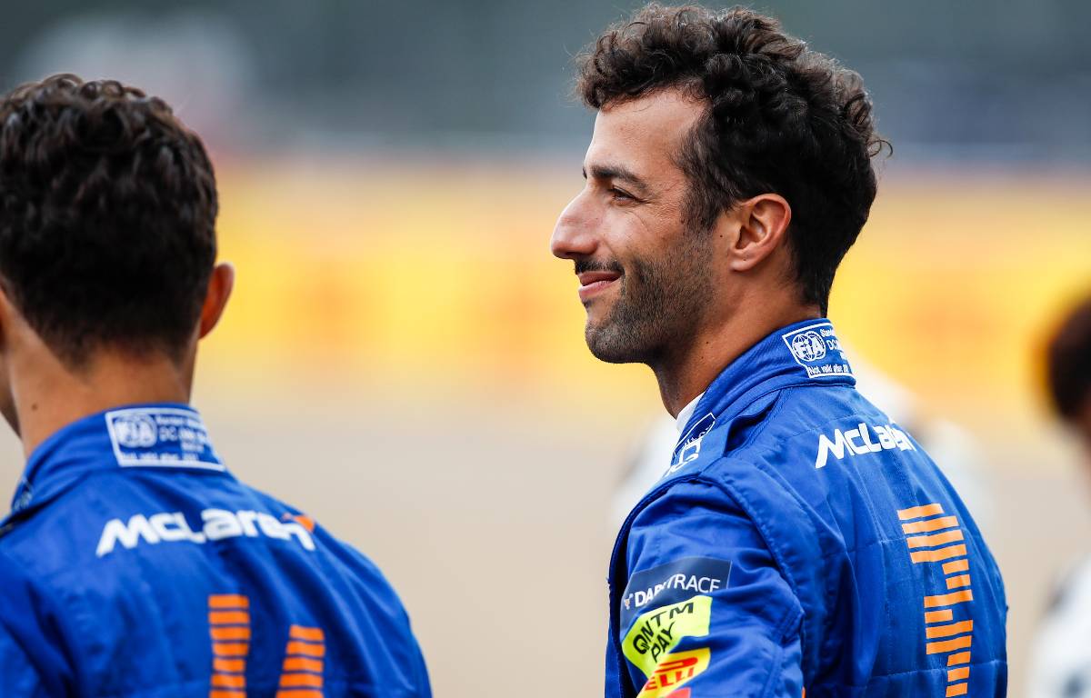 Daniel Ricciardo standing next to Lando Norris. Silverstone July 2021.