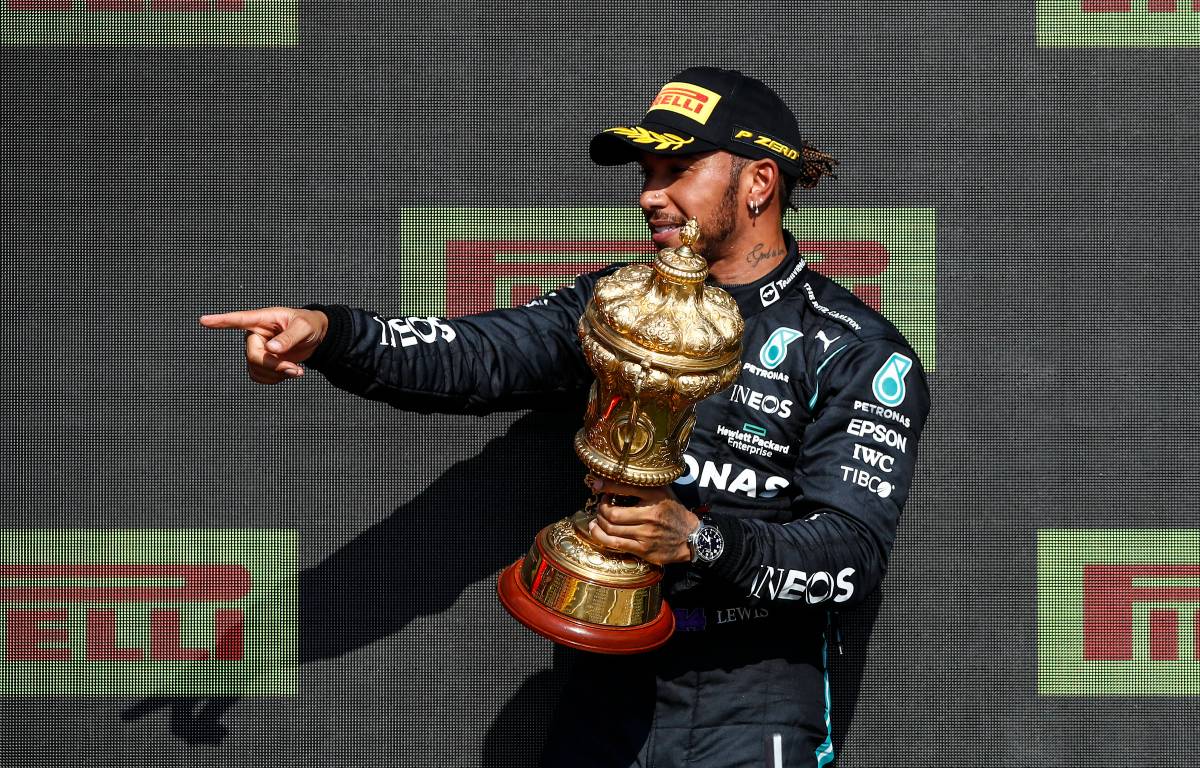 Lewis Hamilton holding the trophy on the British GP podium. Silverstone July 2021.