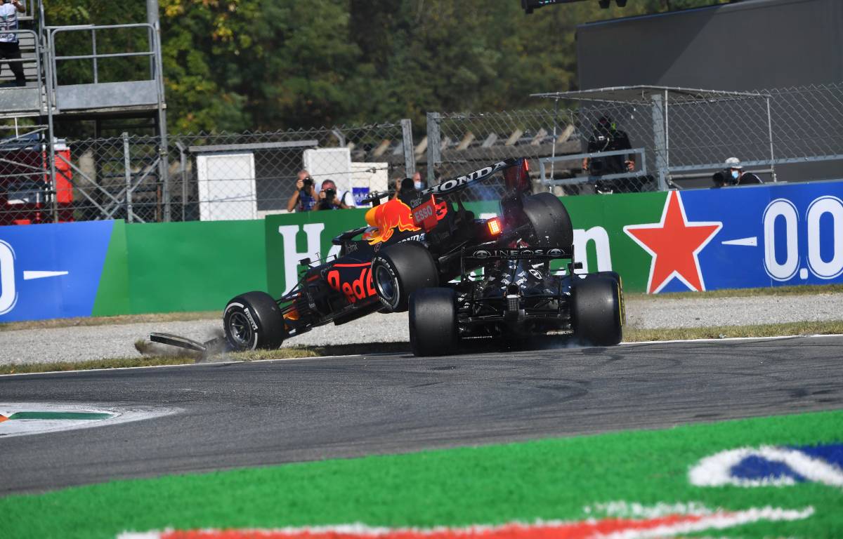 Max Verstappen's Red Bull lands on top of Lewis Hamilton's Mercedes in the Italian GP. Monza September 2021.