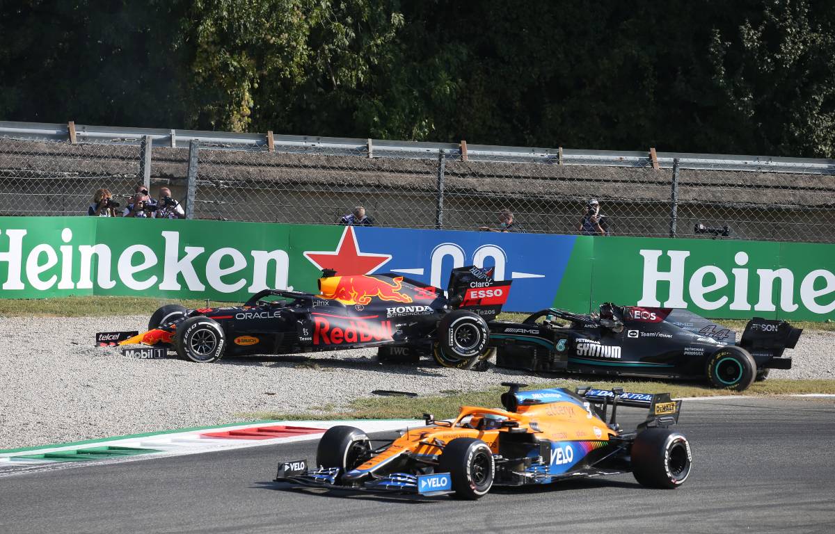 Lewis Hamilton and Max Verstappen in the gravel as Daniel Ricciardo drives past. Monza September 2021.