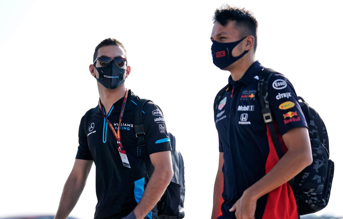 Nicholas Latifi and Alex Albon walk together at Silverstone.