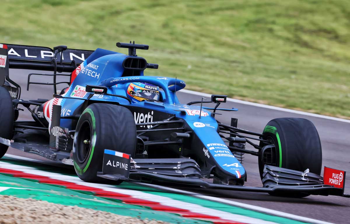 Fernando Alonso drives his Alpine at Imola on intermediate tyres.