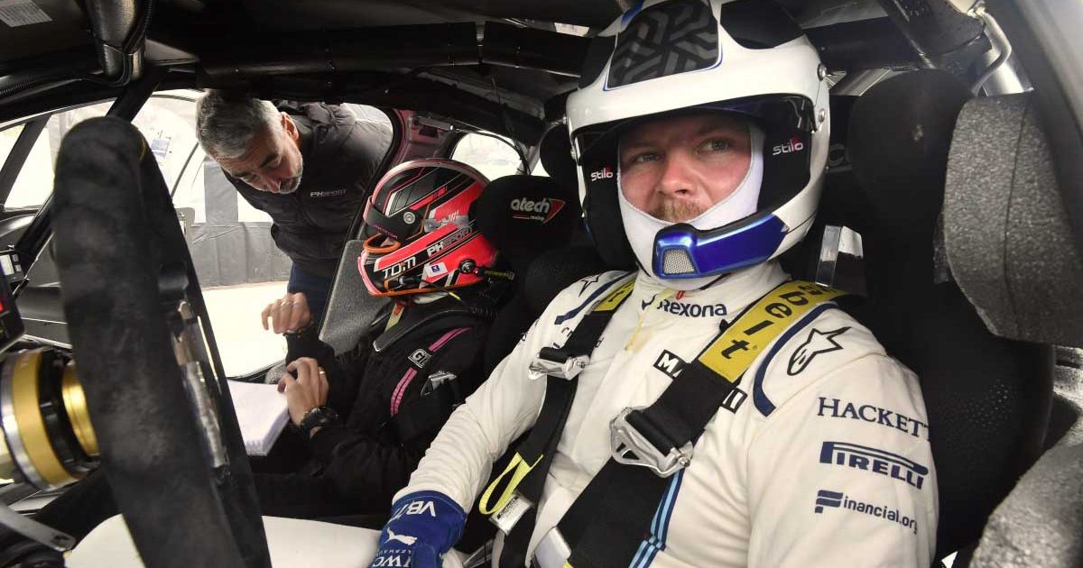 Valtteri Bottas behind the wheel of a rally car.