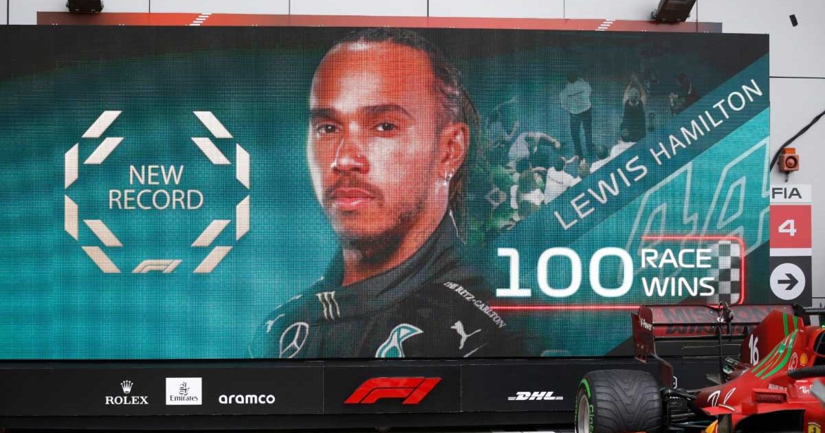 A board shows a graphic as Lewis Hamilton wins his 100th race at the Russian GP.