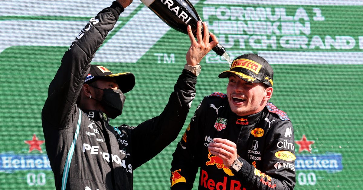 Lewis Hamilton pours champagne over Max Verstappen. Netherlands September 2021