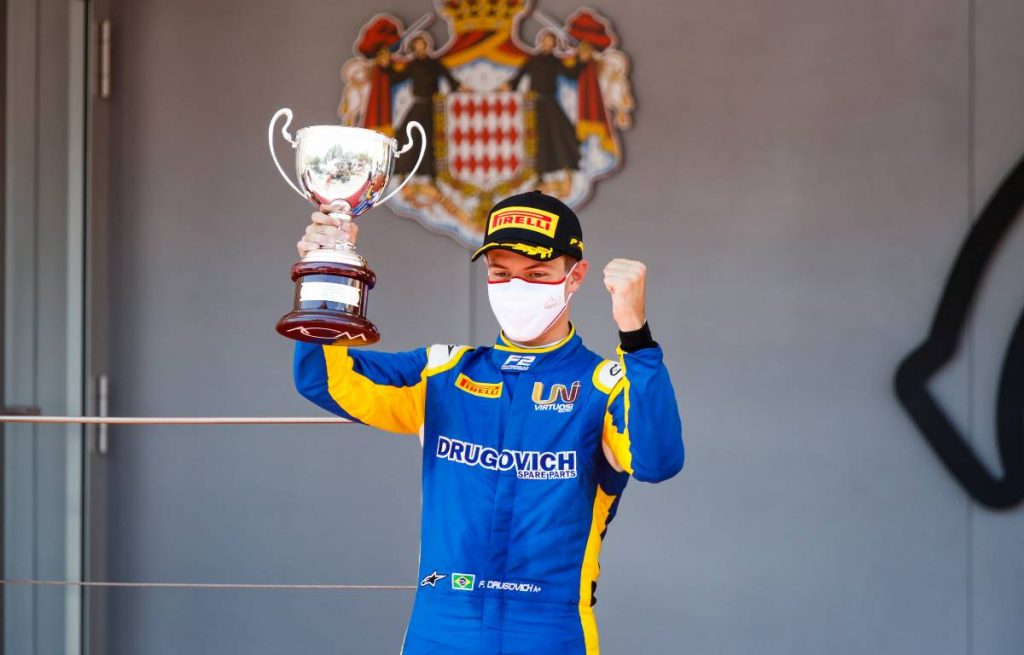 Felipe Drugovich celebrates on the podium after a Formula 2 race. Monaco May 2021.