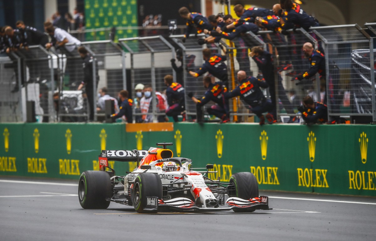 Red Bull mechanics watch Max Verstappen cross the line P2. Turkey, October 2021.