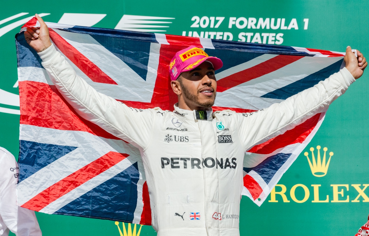 Lewis Hamilton holding a British flag. United States October 2017