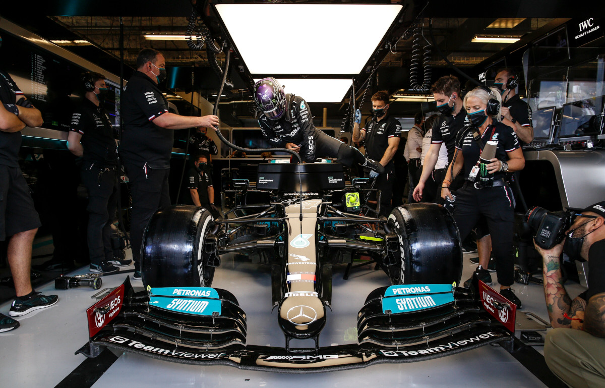Lewis Hamilton climbs into his Mercedes W12. Austin October 2021
