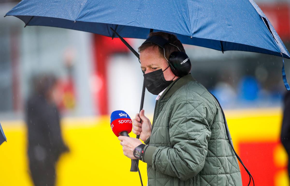 F1 pundit Martin Brundle holds an umbrella on the grid. Italy, April 2021.