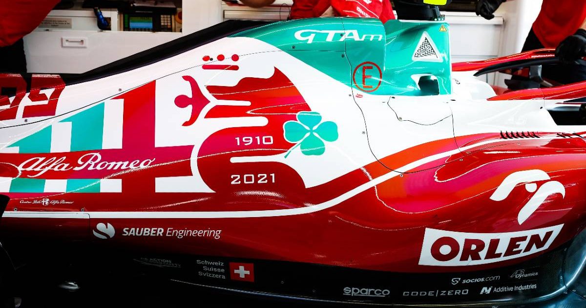 Mechanics work on an Alfa Romeo car at the Italian GP. Monza September 2021.