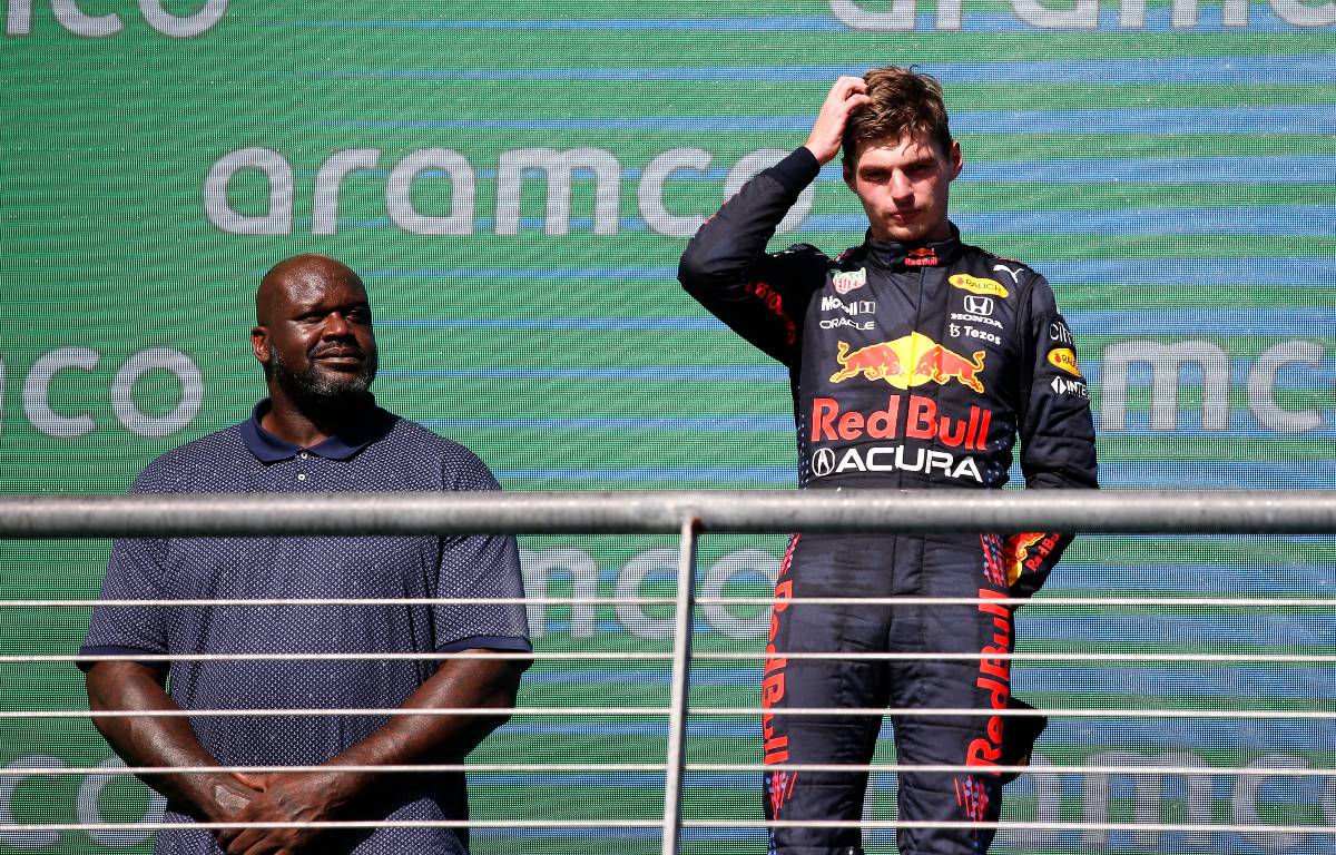 Max Verstappen scratches his head on the podium after winning the US Grand Prix. Austin October 2021.