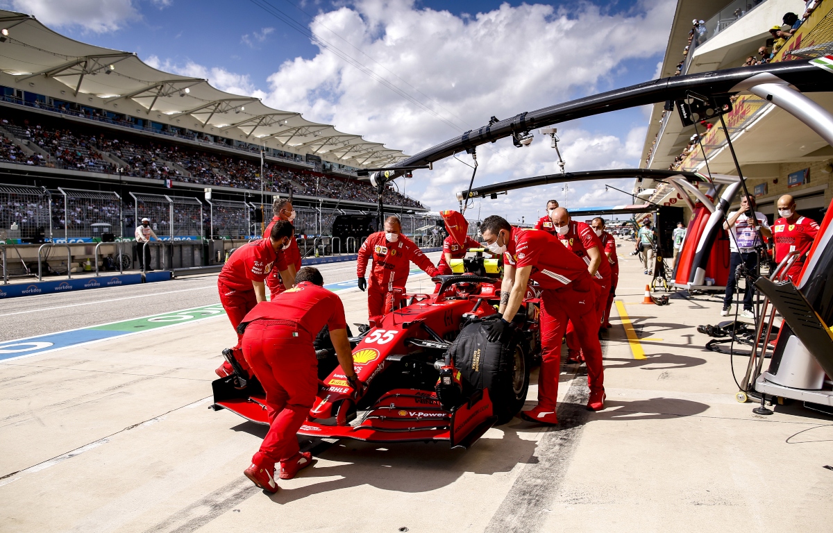 Ferrari mechanics pushing Carlos Sainz into the garage. Austin October 2021