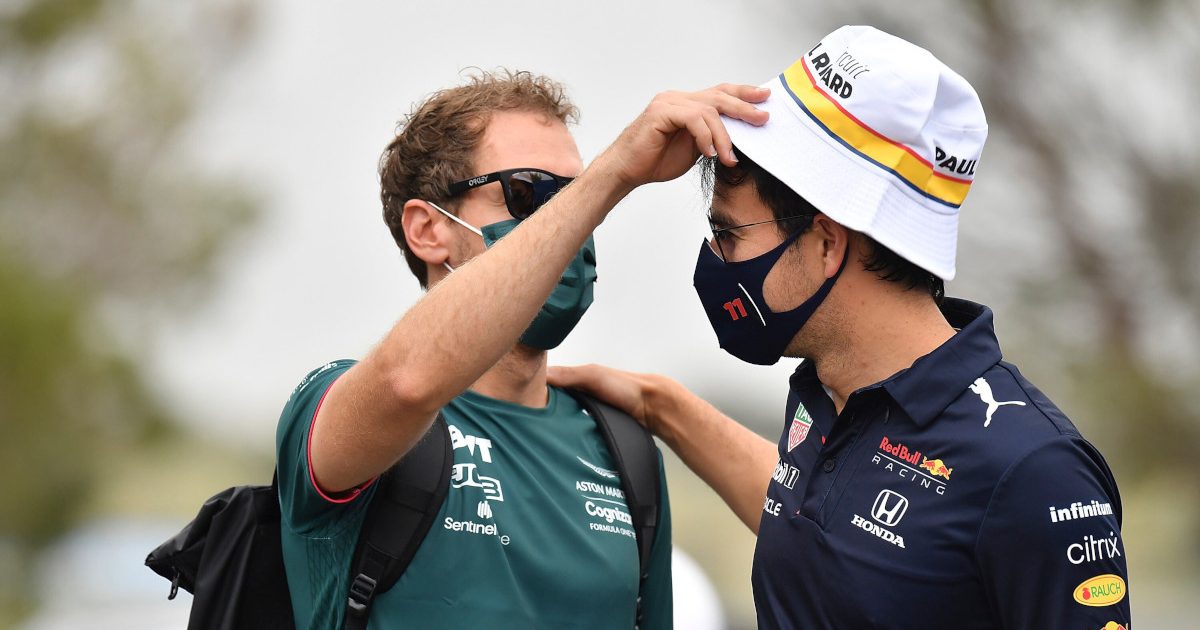 Sebastian Vettel adjusts Sergio Perez's hat. France June 2021